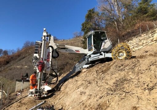 excavator drill; excavator drill attachment; excavator mounted drill attachment; rock drilling