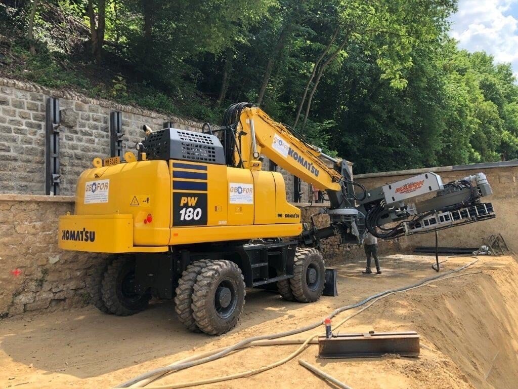 excavator drill; excavator drill attachment; excavator mounted drill attachment; rock drilling